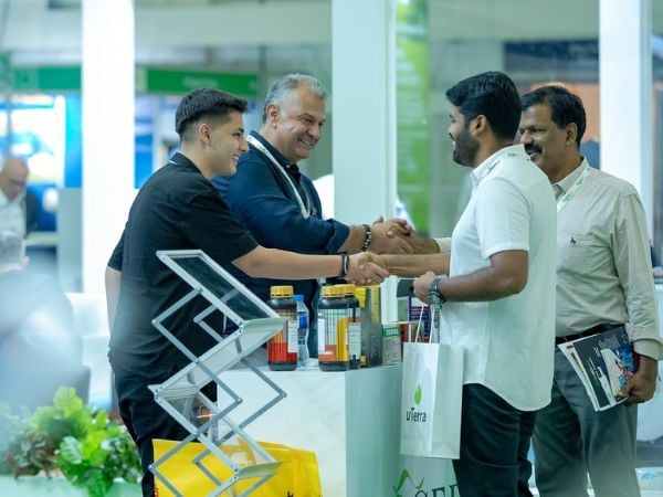 Business handshake and buyer interaction at Growtech Middle East